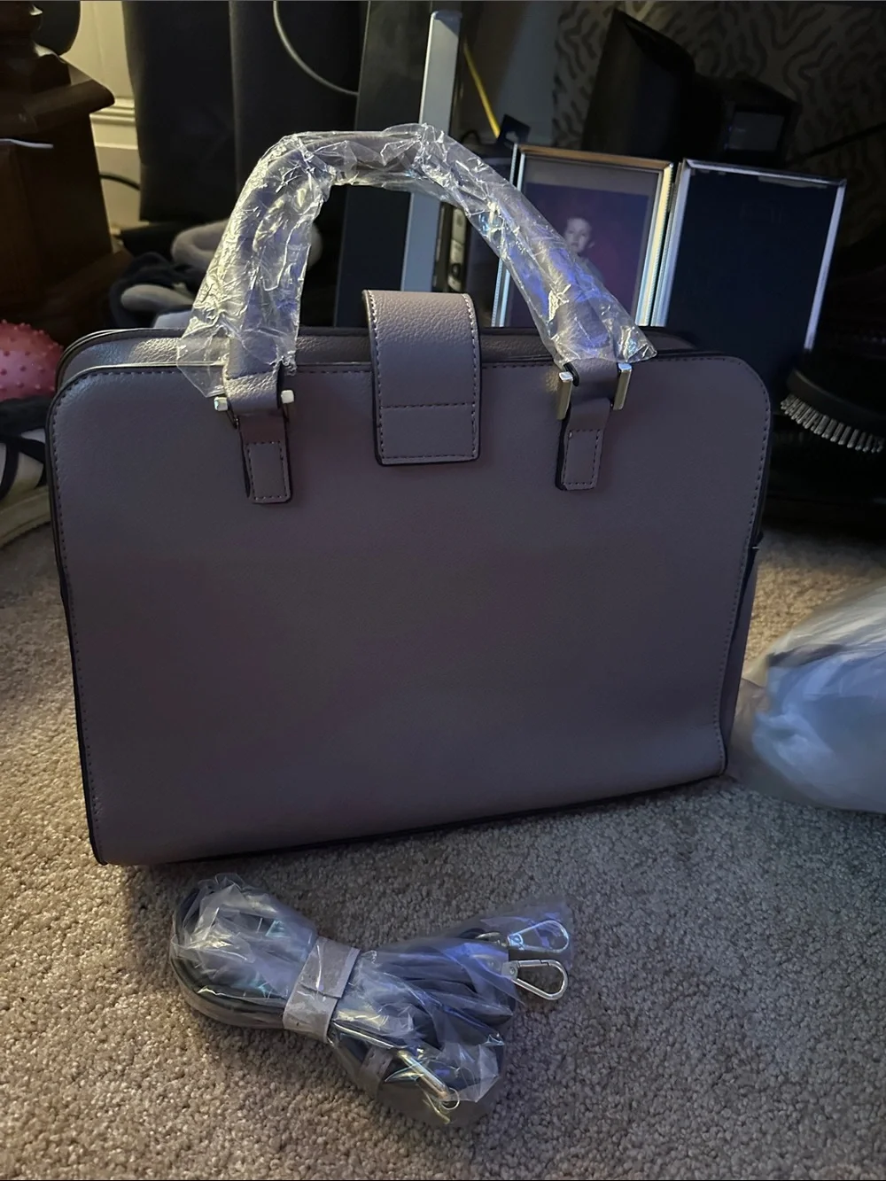 Gray purse with cross body strap